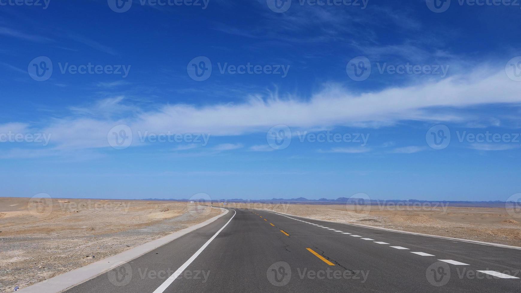 high way road under sunny blue sky in Dunhuang Gansu China. photo