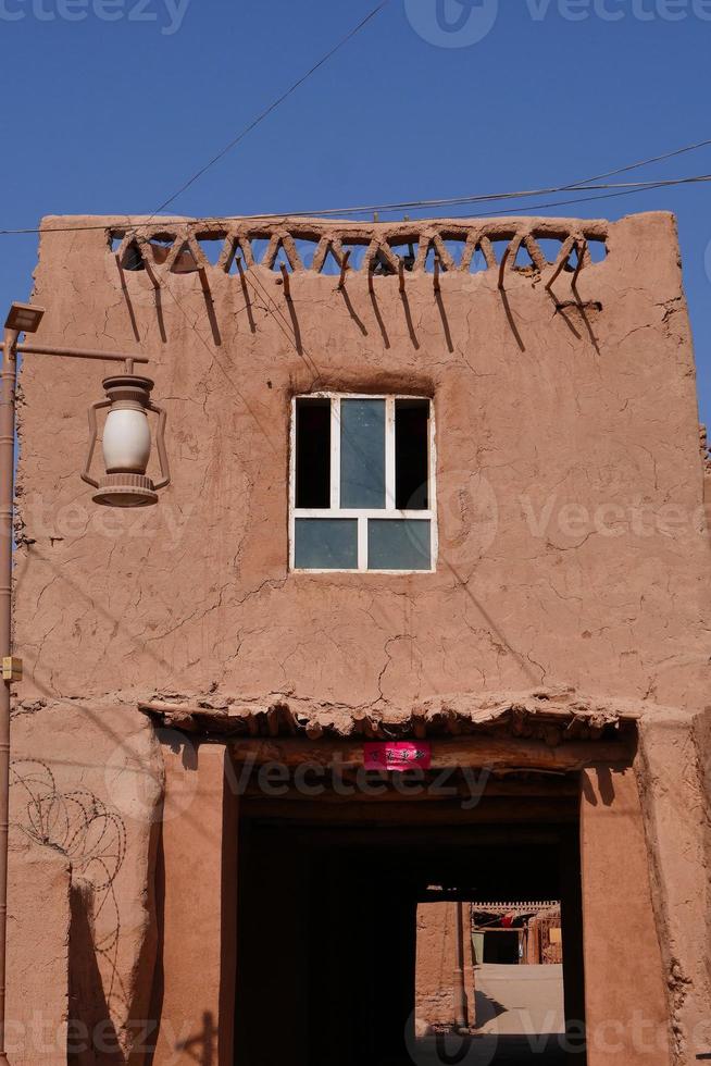 residential old house in Tuyoq village valley Xinjiang Province China. photo