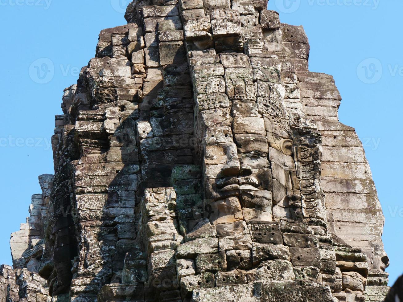 Face tower at the Bayon Temple, Siem Reap Cambodia photo