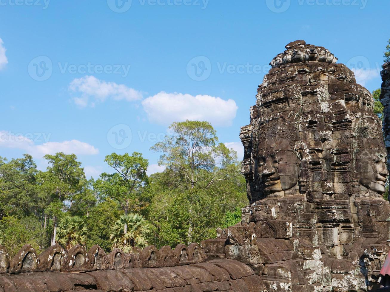 Face tower at the Bayon Temple, Siem Reap Cambodia photo