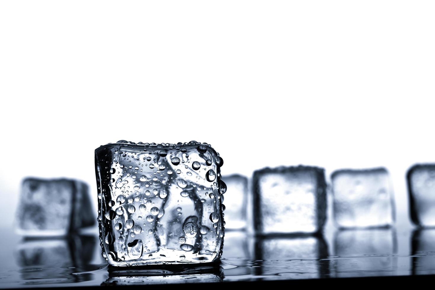 Ice cubes with water drop photo