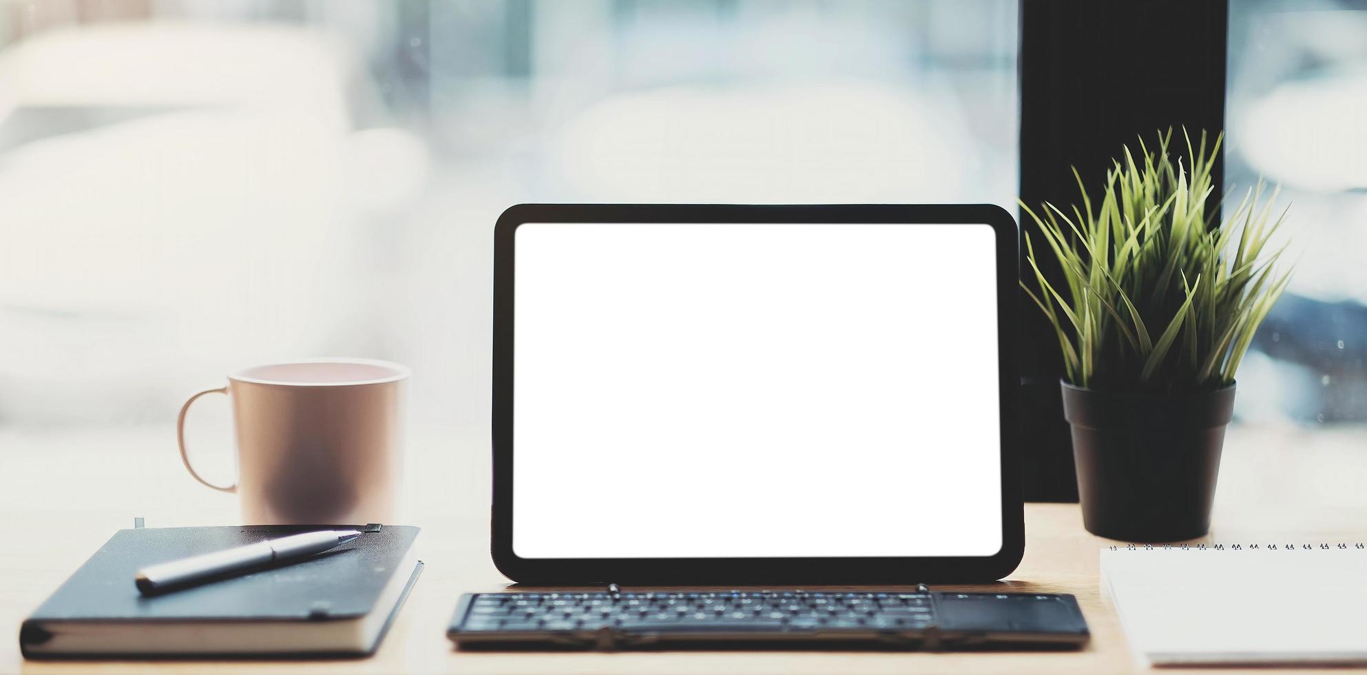 Conceptual workspace, Laptop computer with blank white screen photo