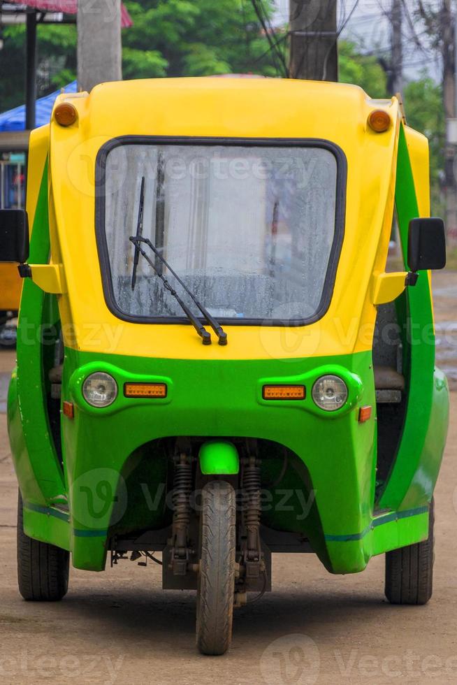 Eco-friendly electronic tuk tuk rickshaw in Luang Prabang Laos. photo