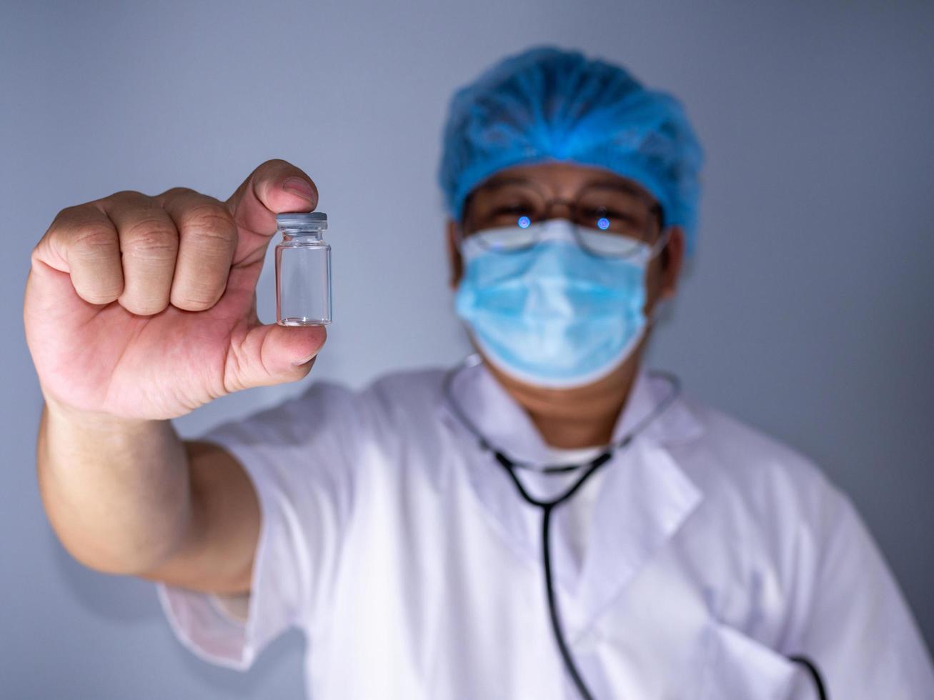 Portrait of a doctor wearing a mask and wearing a hat . photo