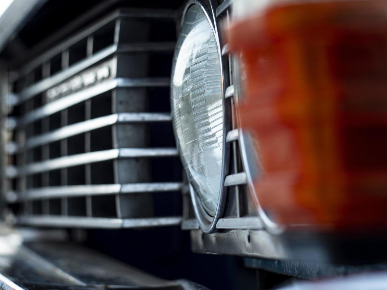 Headlight and grille closeup of an old beautiful car photo