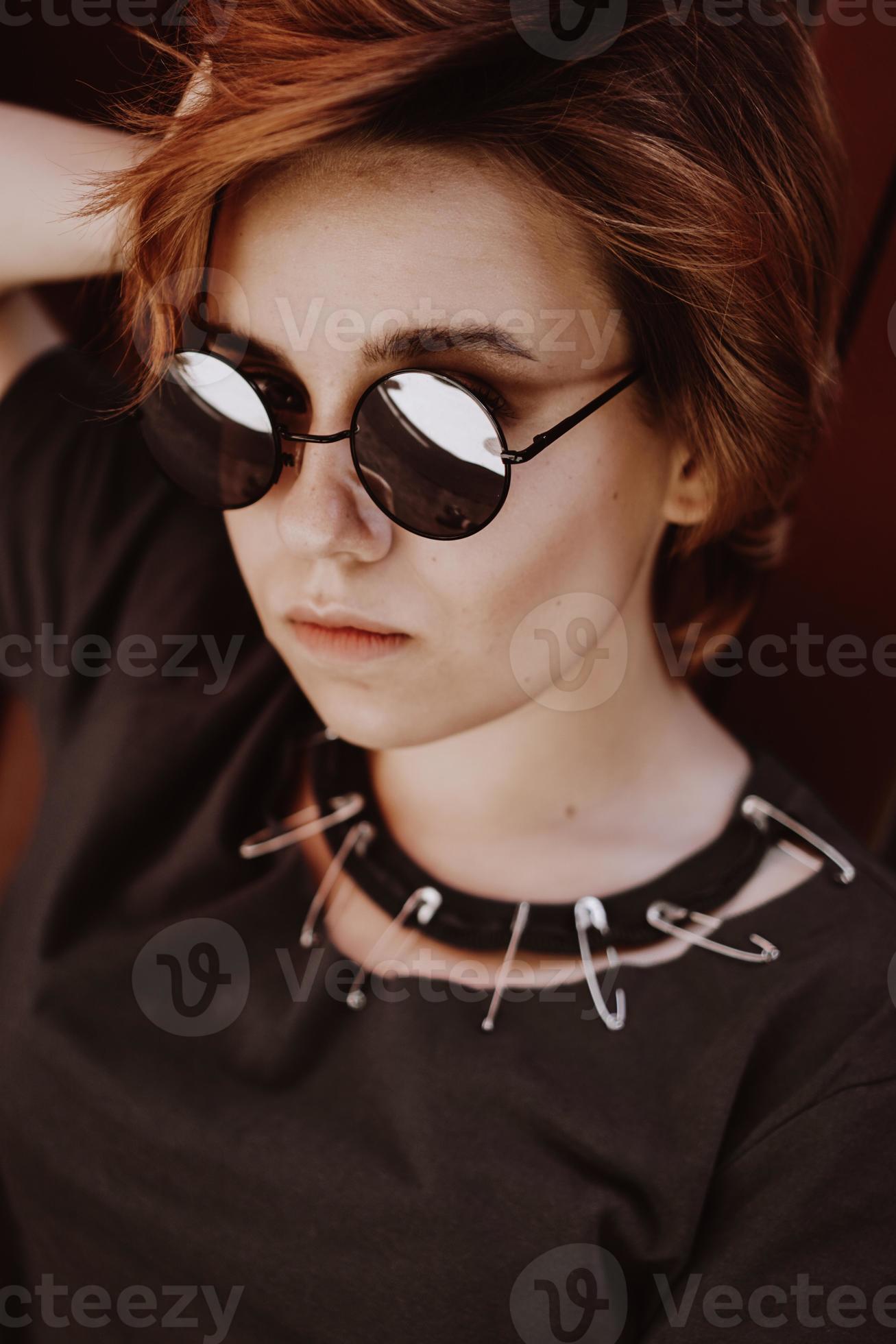 Portrait of attractive cheeky woman with short red hair in sunglasses  3396354 Stock Photo at Vecteezy