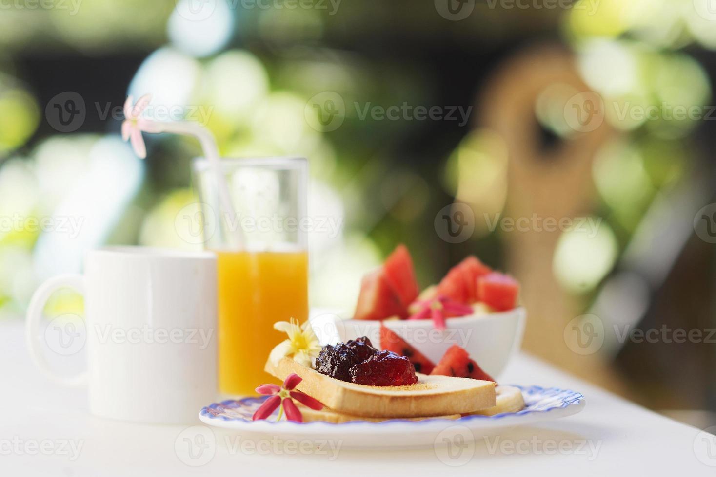 jam toast juice fruit and coffee set photo