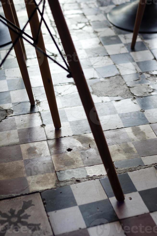 traditional design old rustic floor tiles detail in spanish cafe photo