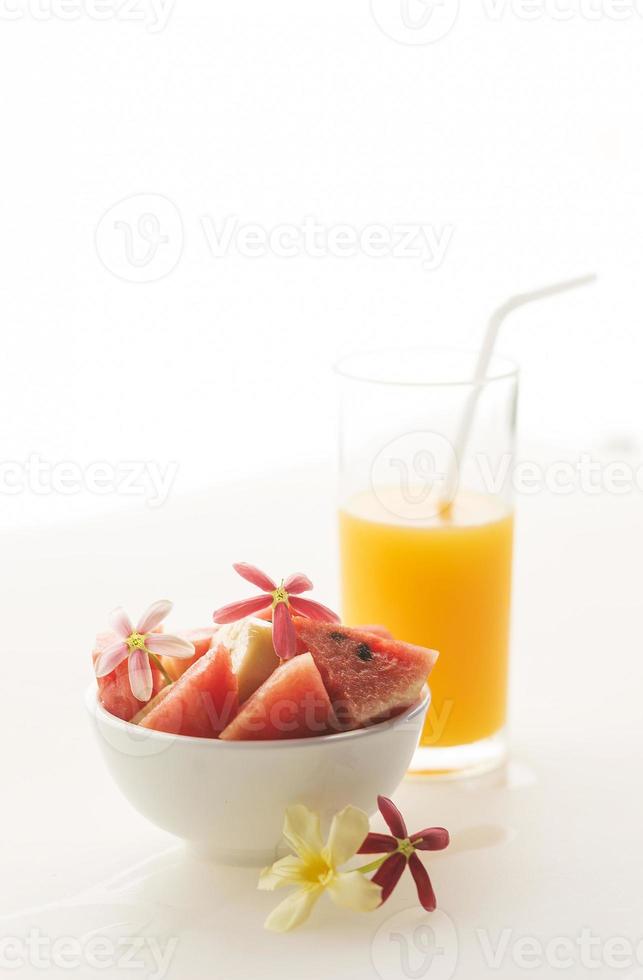 watermelon and banana fruit salad with fresh orange juice photo
