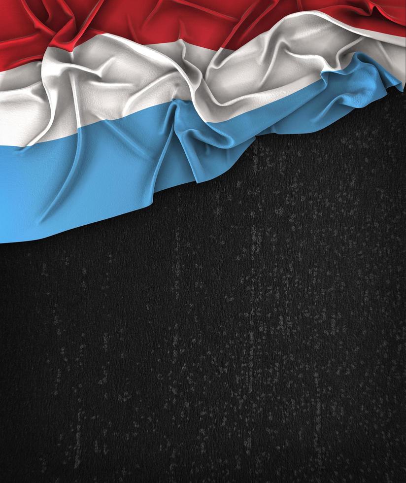 Luxembourg Flag Vintage on a Grunge Black Chalkboard photo