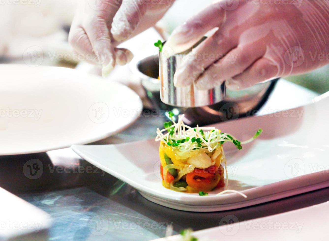 chef cooking, Chef preparing food, Chef decorating dish in the kitchen photo