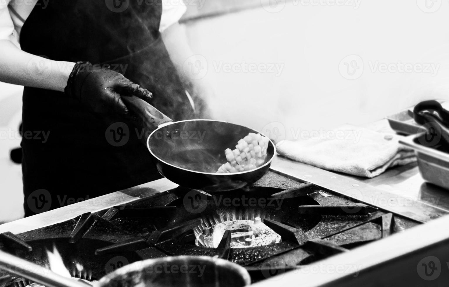 chef preparing food, chef cooking in a kitchen, chef at work photo