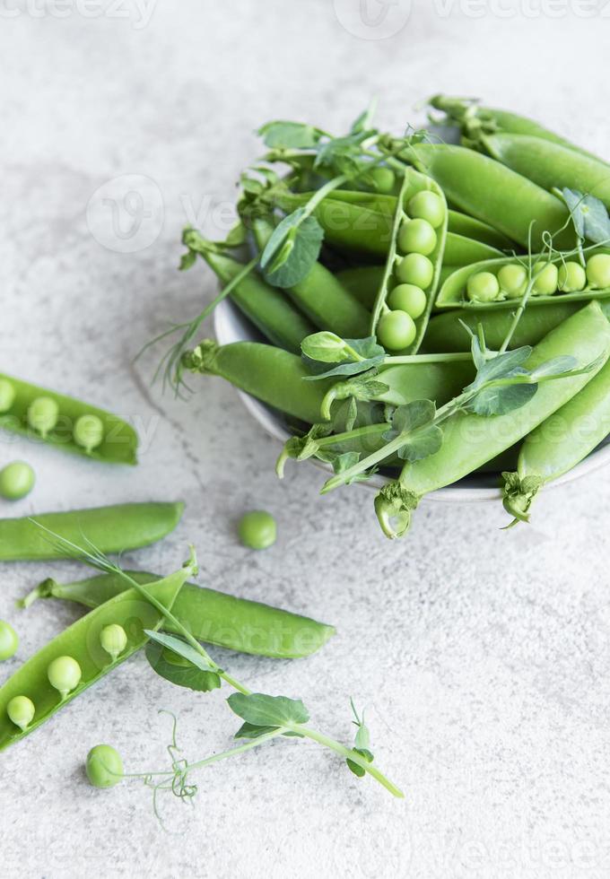 Fresh green peas pods and green peas with sprouts photo