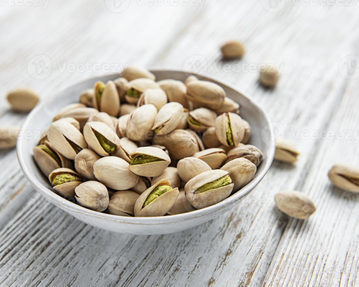 Bowl with pistachios photo