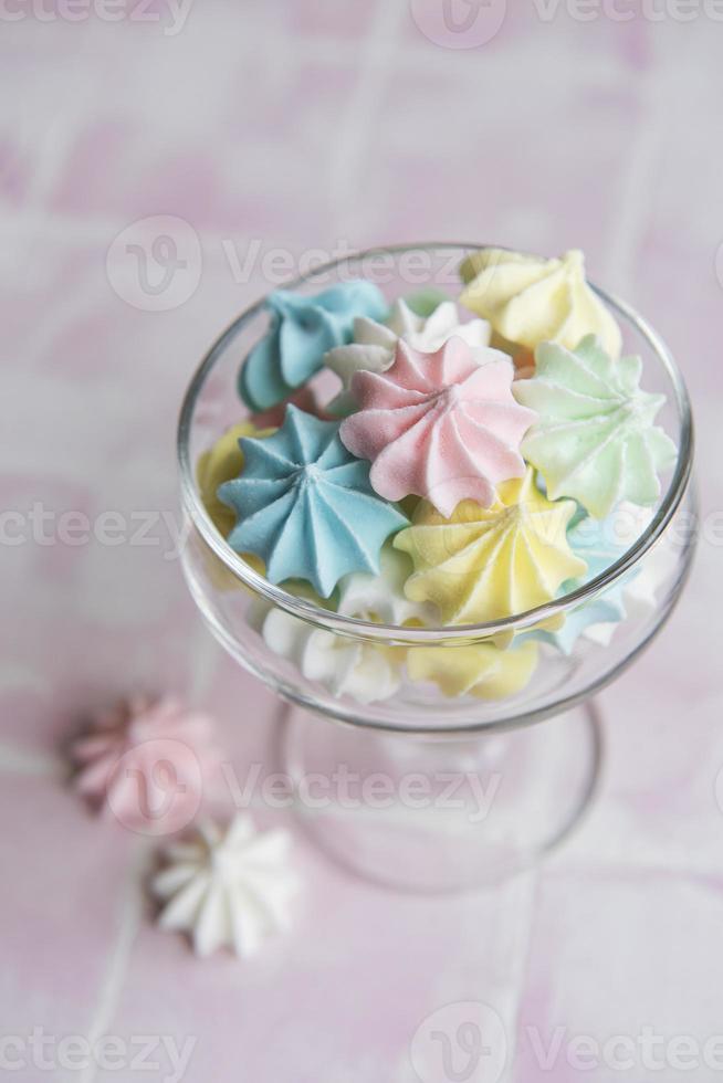 Small colorful meringues in the glass photo