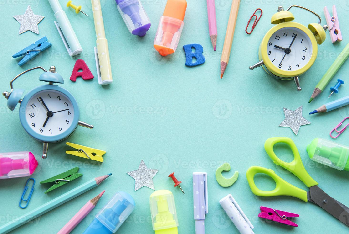 Frame of different stationery on green background photo