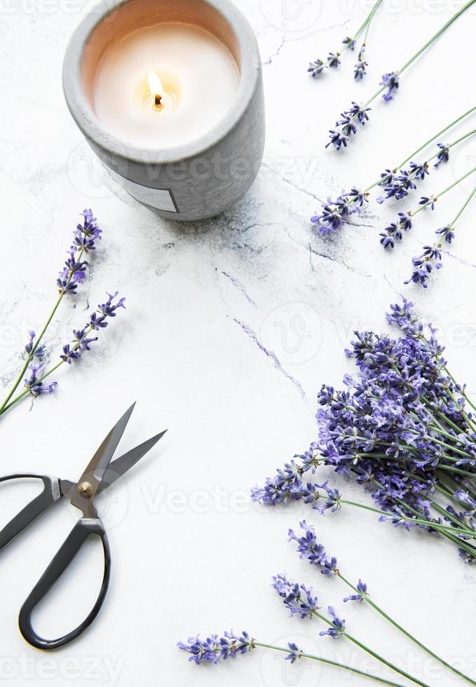 Lavender flowers, candle and scissors photo