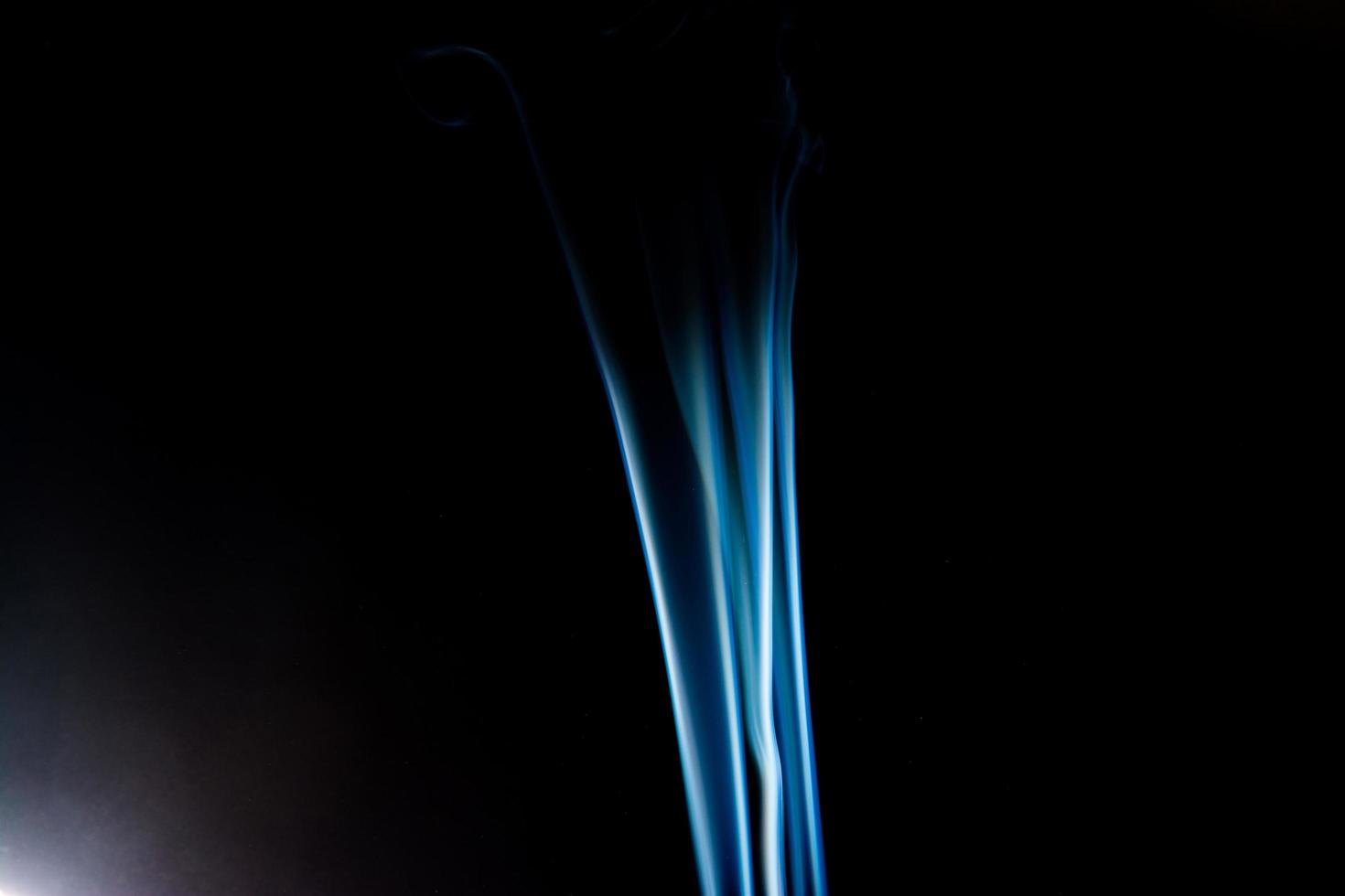 Blue smoke on black background, smoke abstract photo