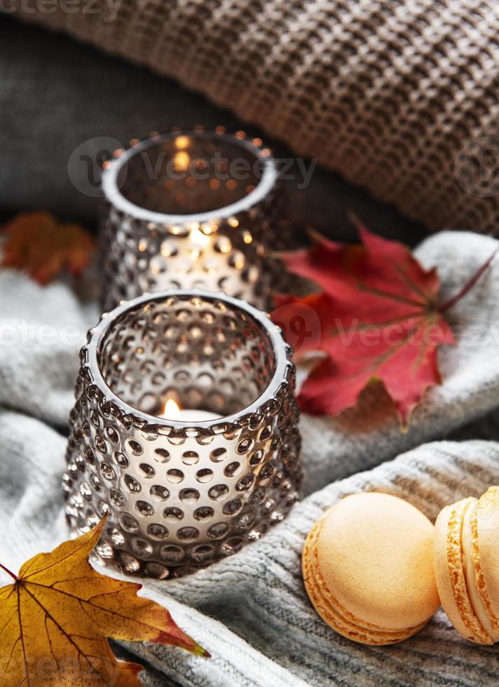 Knitted sweaters and candles photo