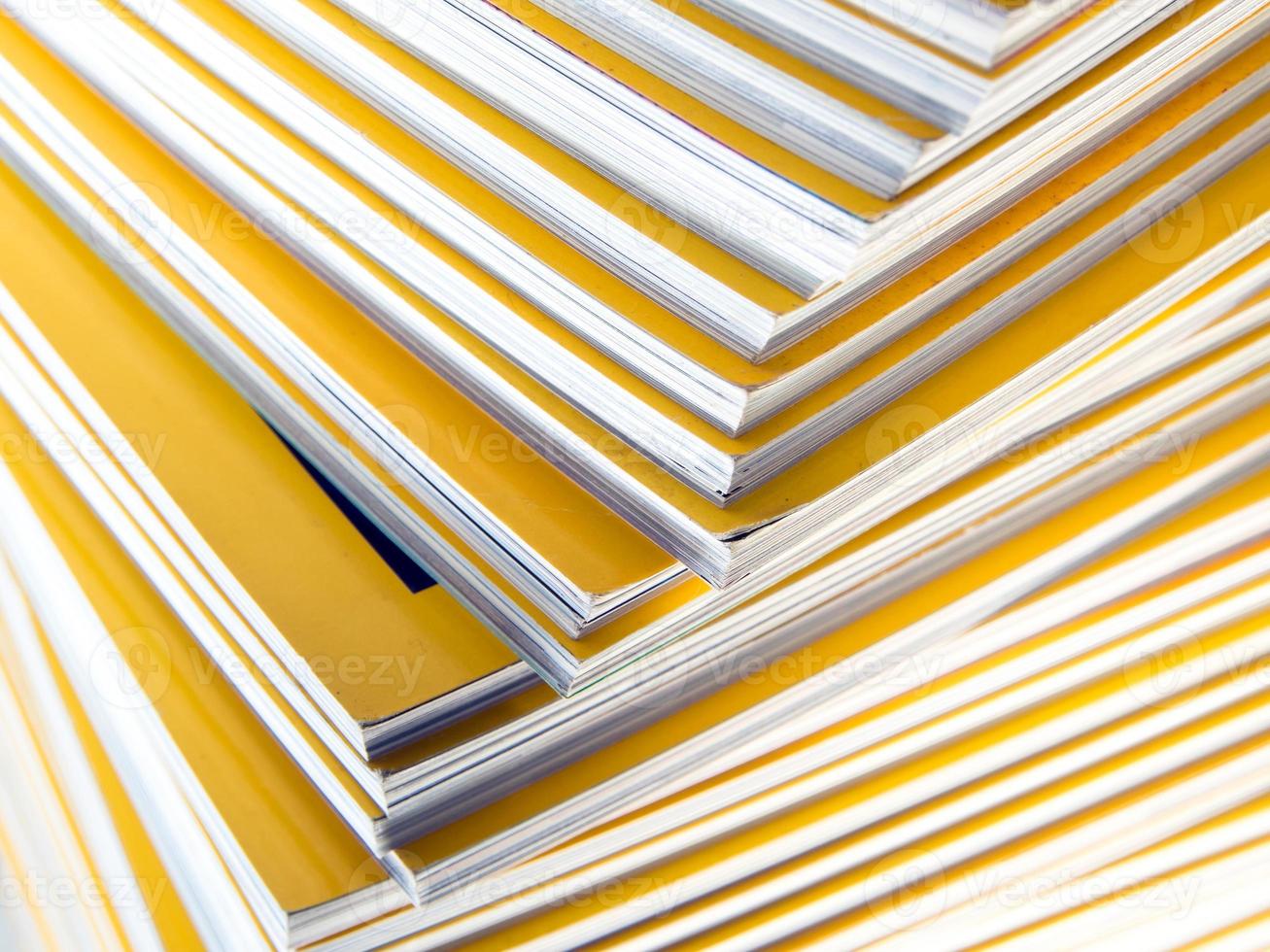 Stack of yellow monthly magazine photo