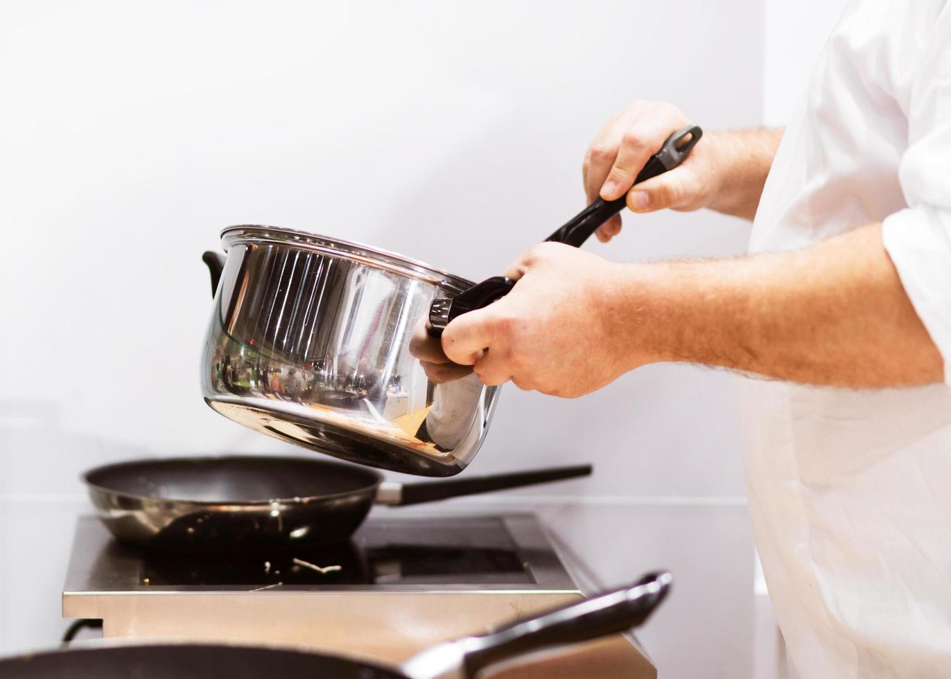 Chef cooking food in the kitchen, Chef preparing food photo