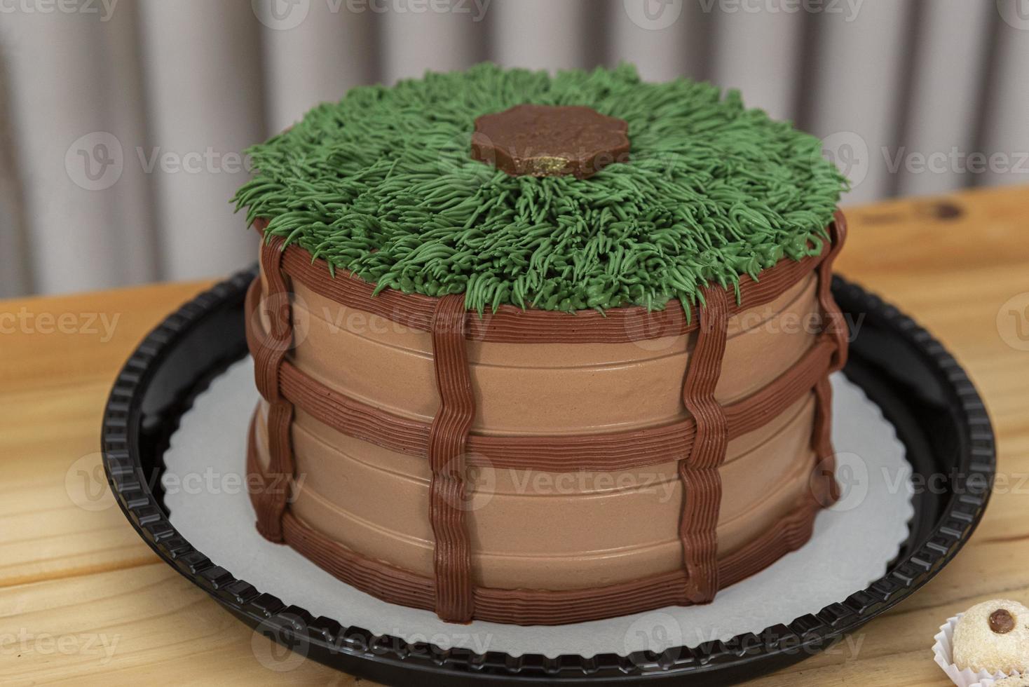 cake decorated in country theme on a light wooden table. photo