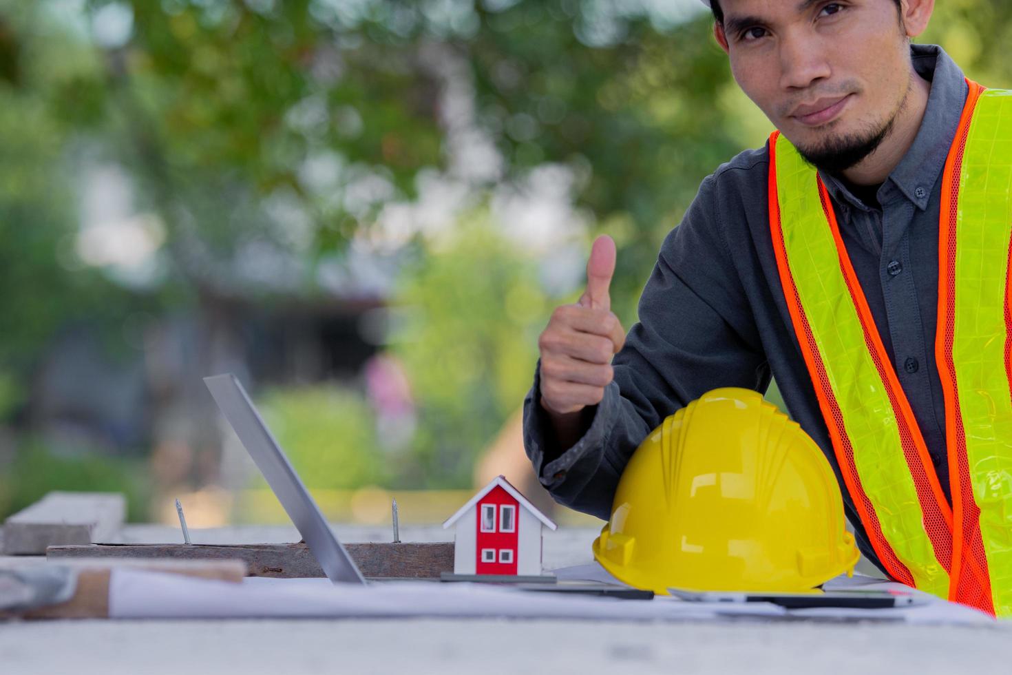 Construction engineer with yellow hard hat photo