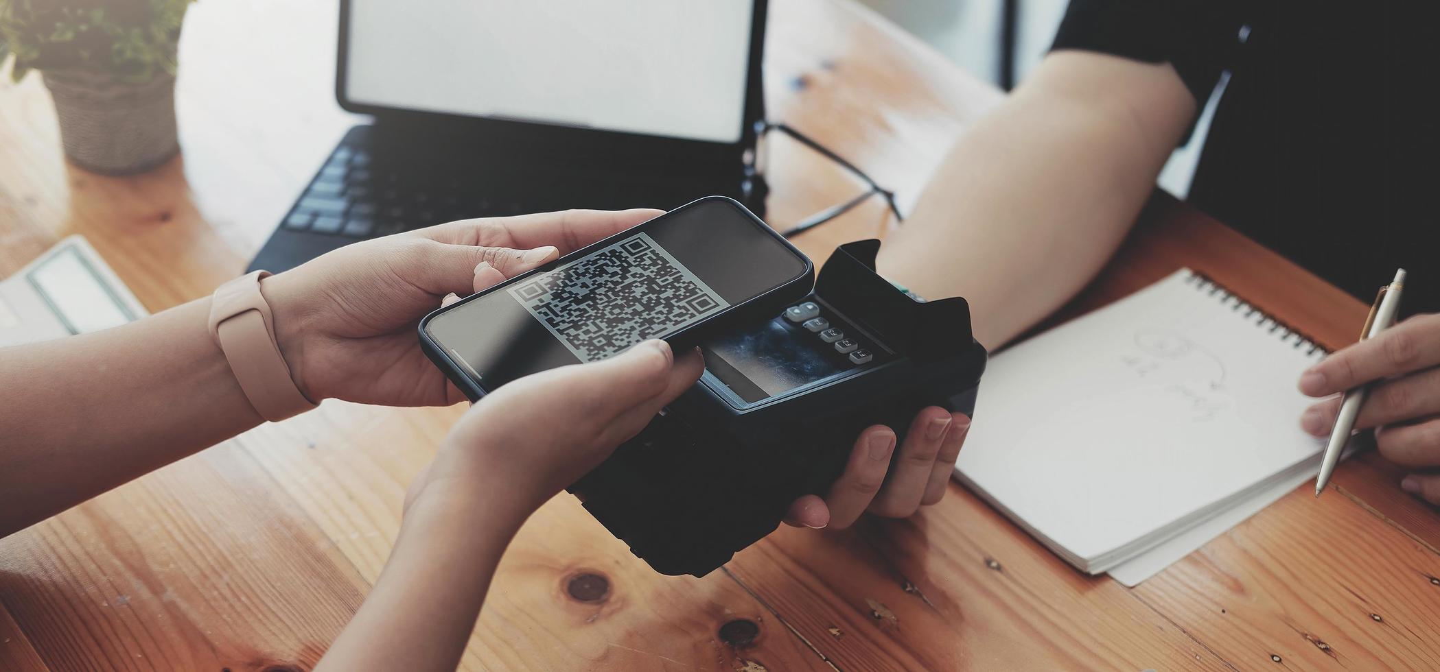 Close-up of asian customer using his credit card to swipe with EDC photo