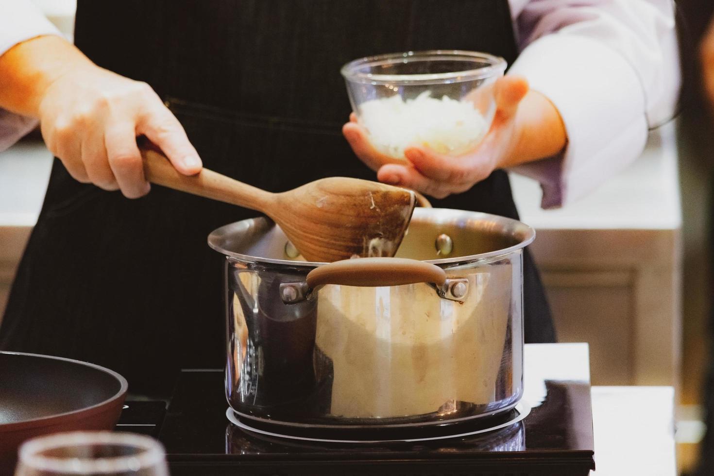 Chef preparing food in the kitchen, chef cooking, Chef decorating dish photo