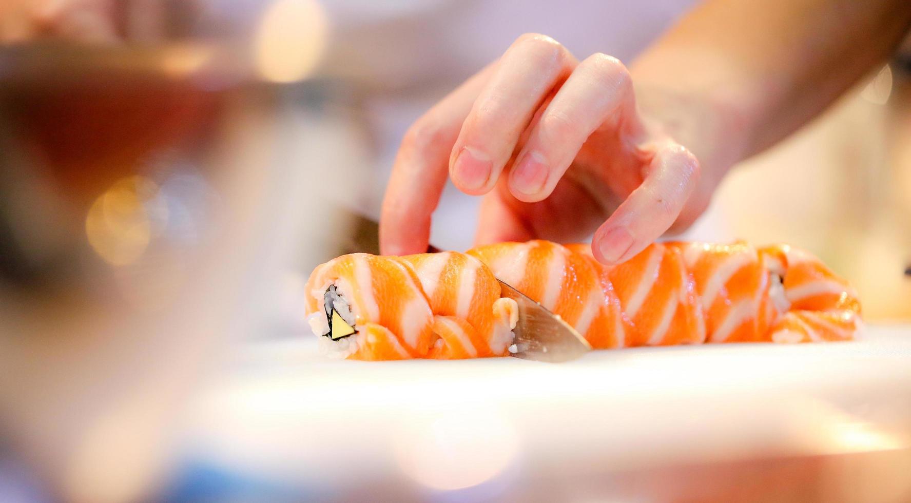 chef hands preparing japanese food, chef making sushi photo