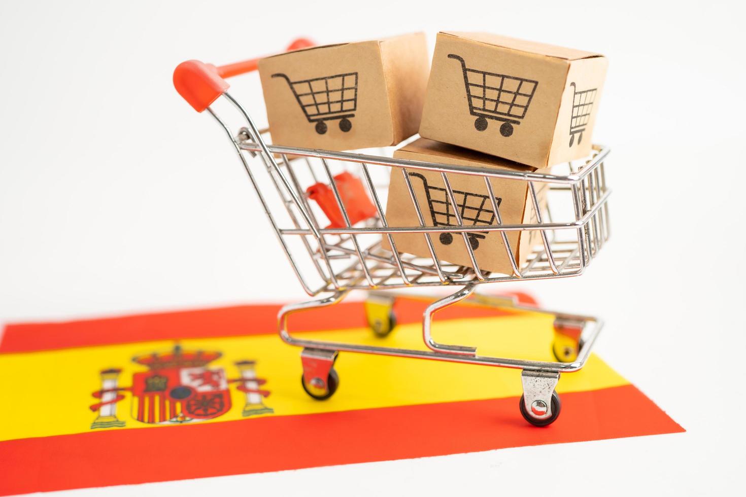 Box with shopping cart logo and Spain flag, photo