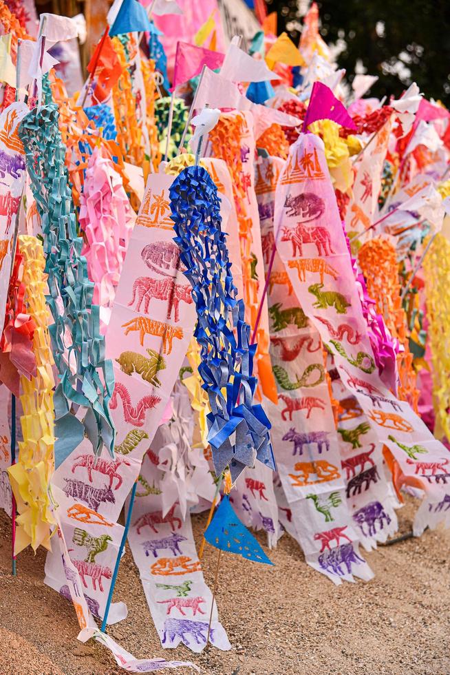 Paper flag on Sand pagoda in Songkran Festival Chiang Mai, Thailand. photo