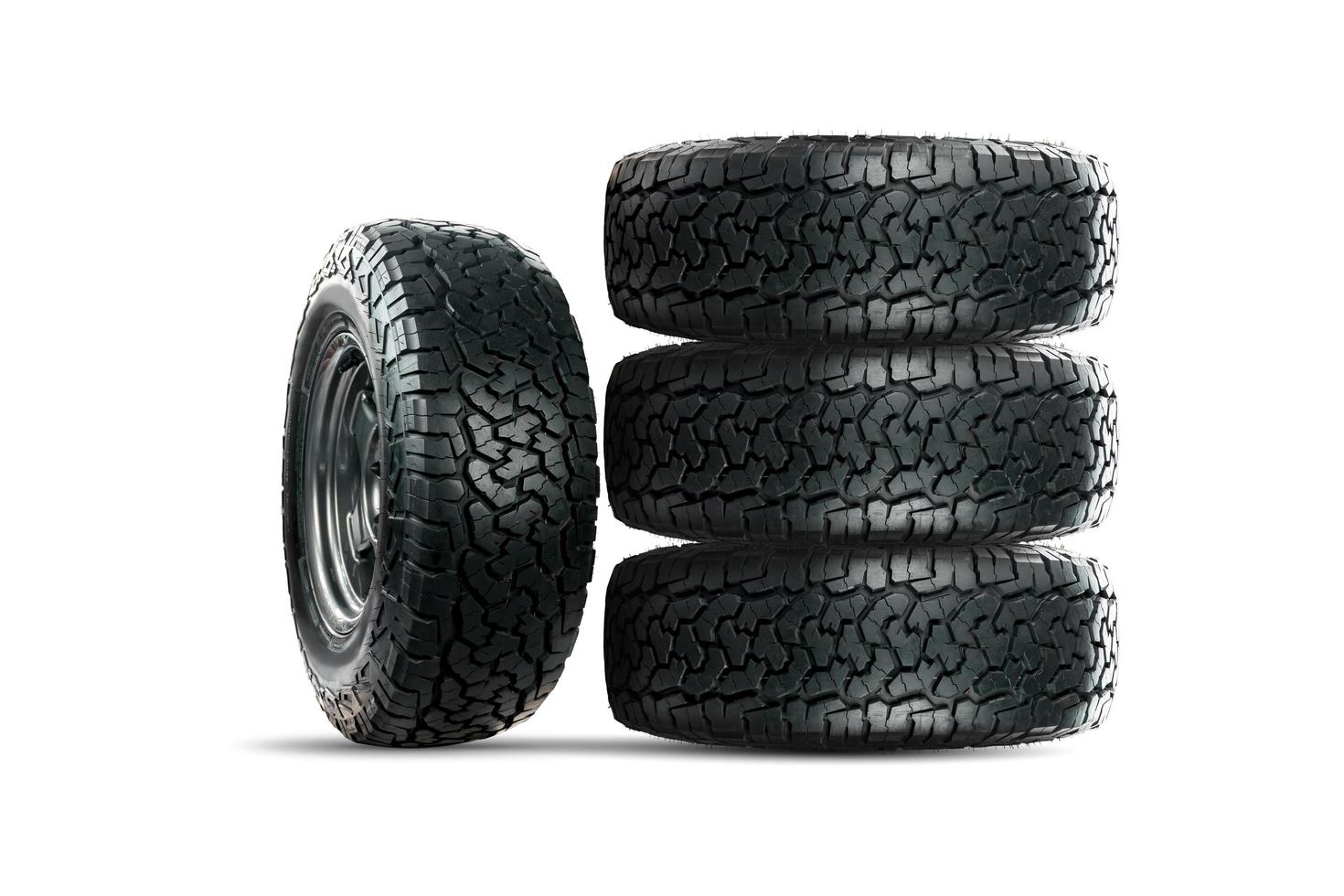 Set of 4 wheels car tires isolated on white background. photo