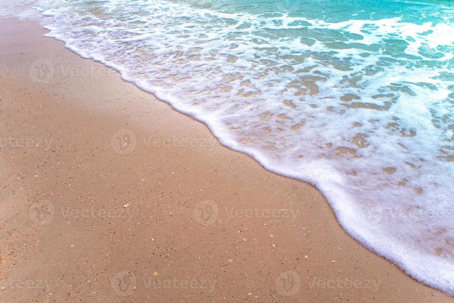 Bubble of Sea wave on sand photo