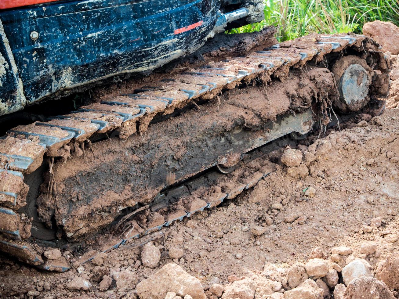 Tracked vehicle working in farm photo