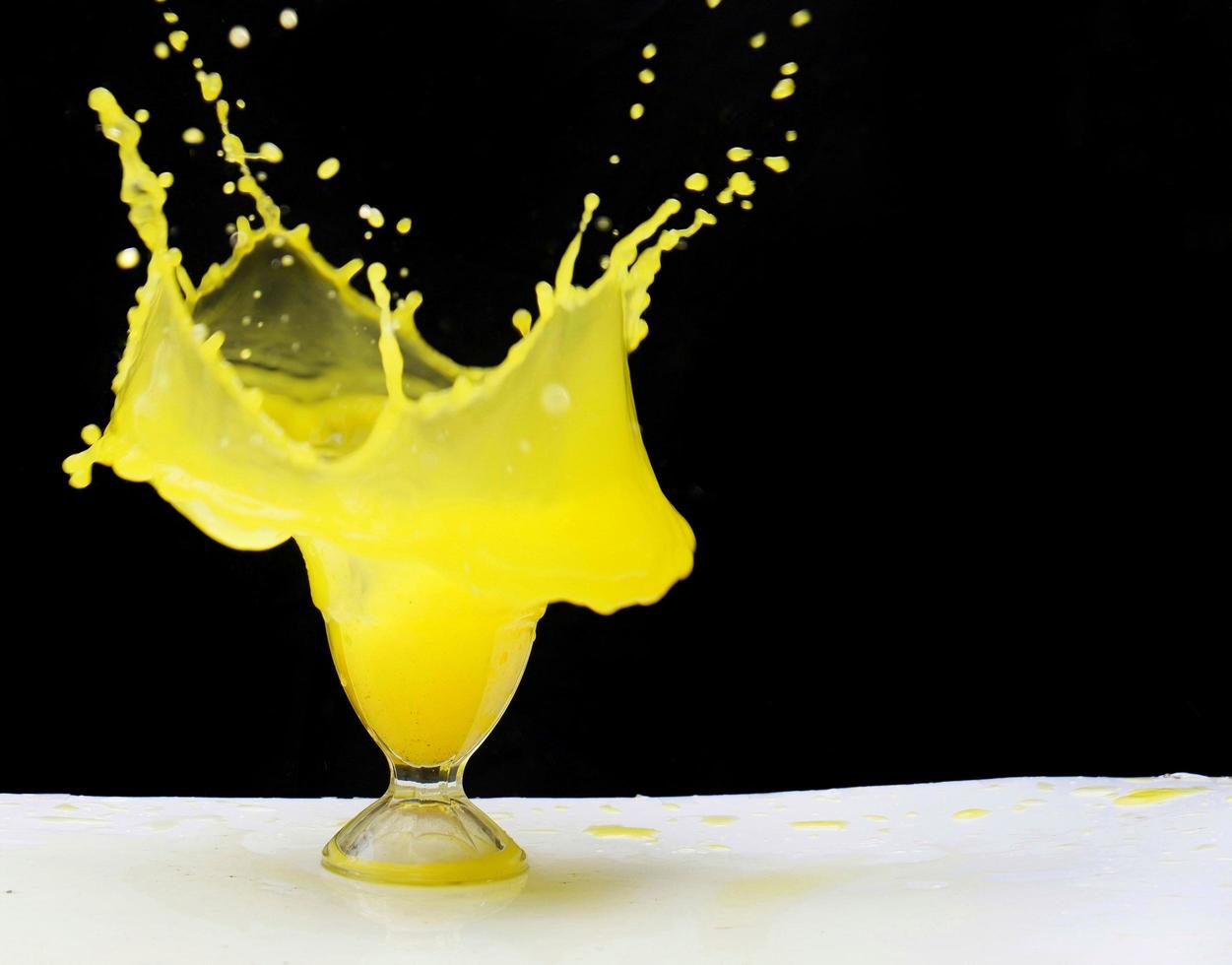 Fresh orange drink for summer isolated on black background photo