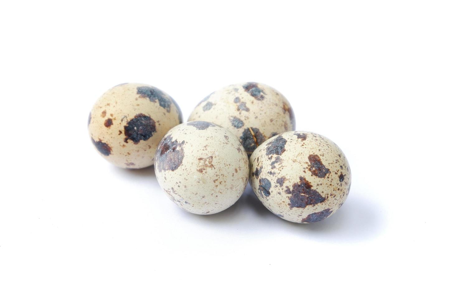 Quail eggs isolated on a white background photo