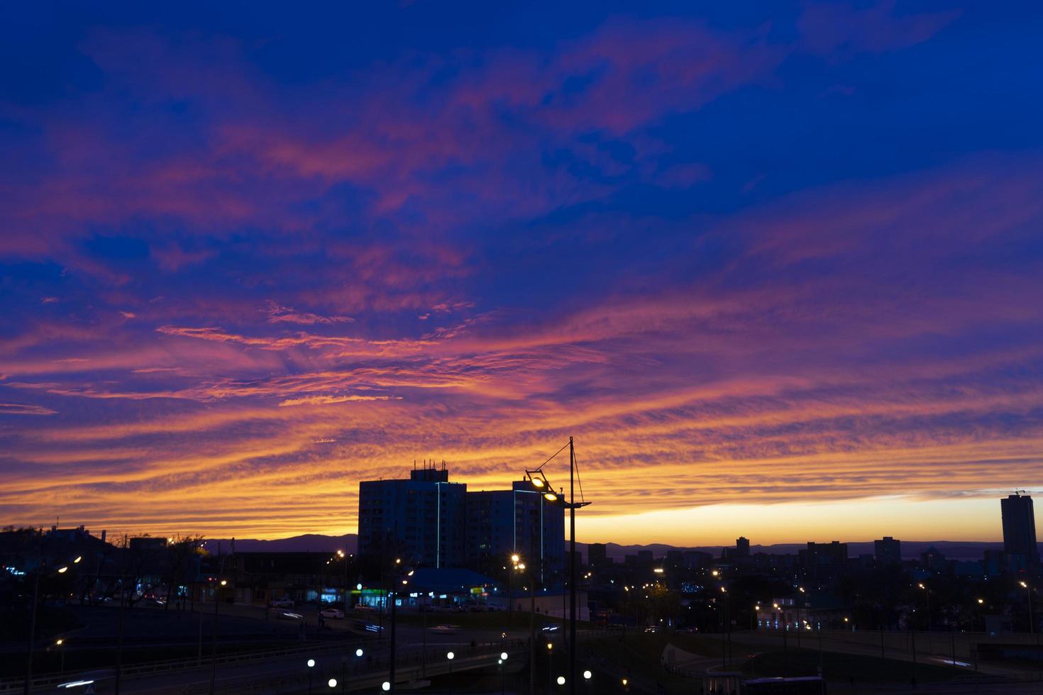 Urban landscape under the evening purple sky photo