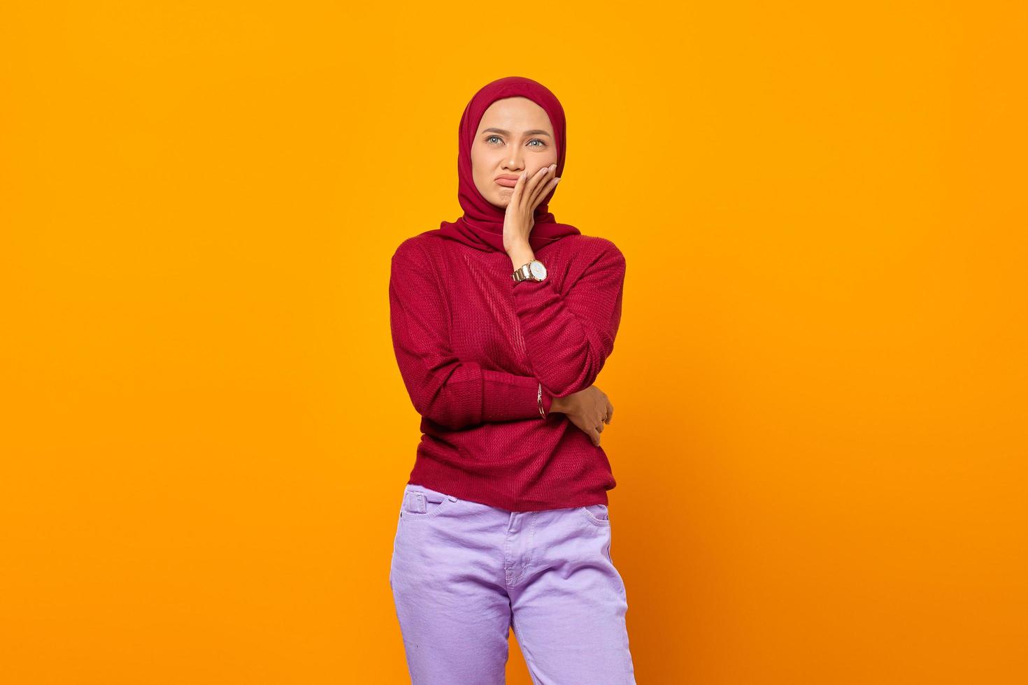 Portrait of minded girl touching her chin hand photo