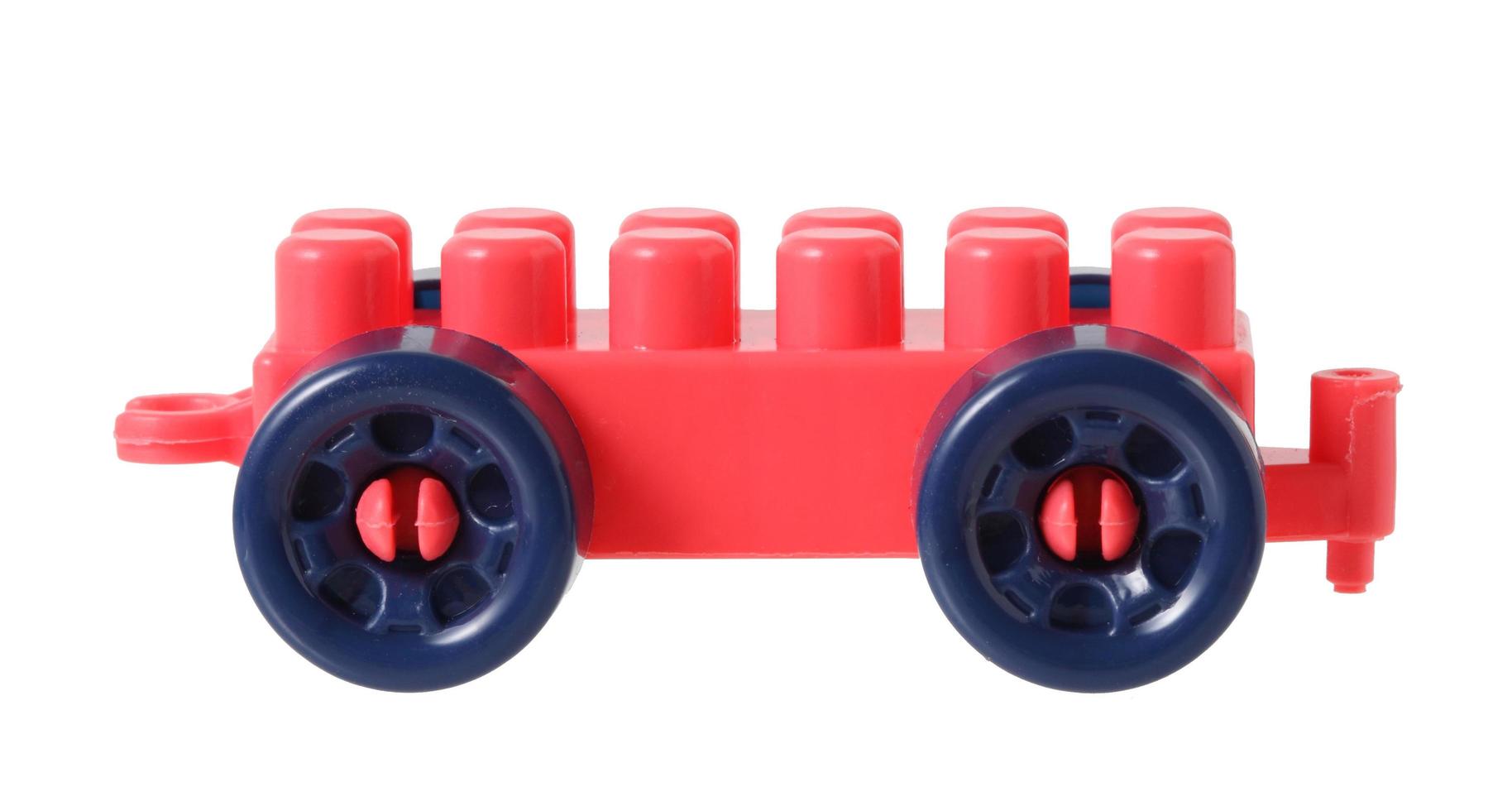 Small train from plastic blocks on white background photo