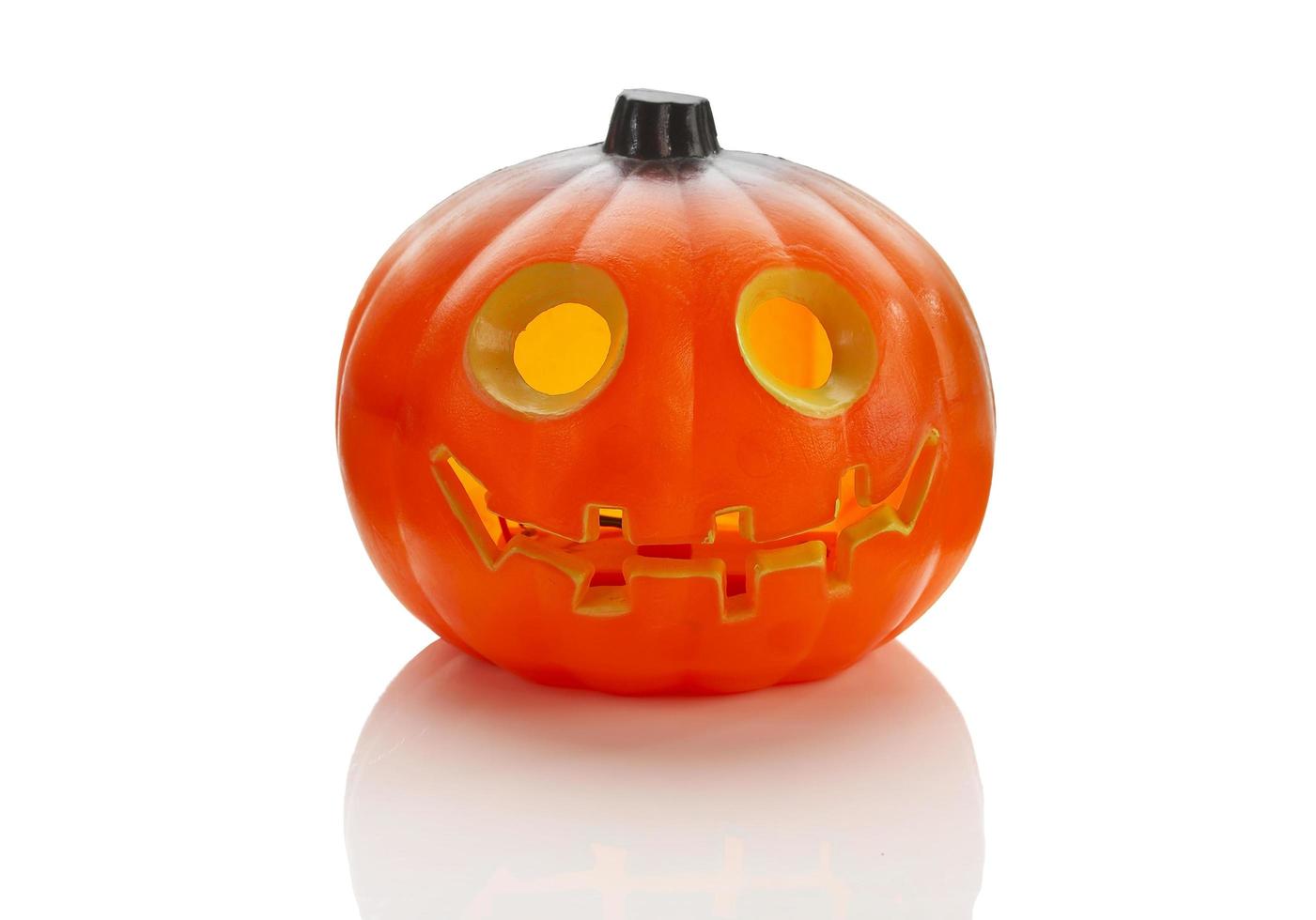 One Halloween plastic pumpkin on white background photo