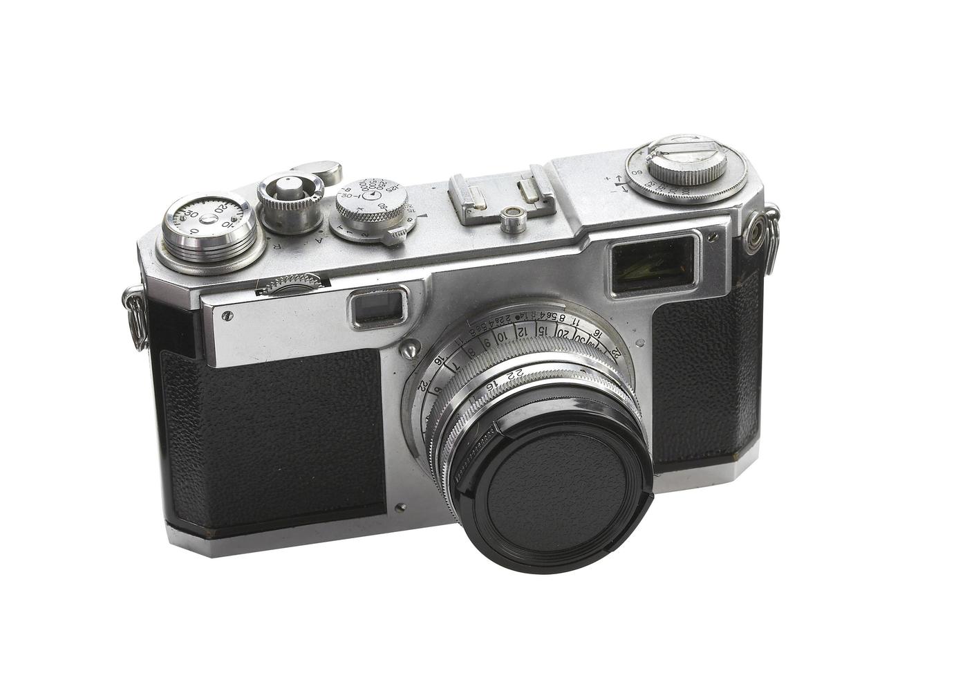 Old film camera on white background photo