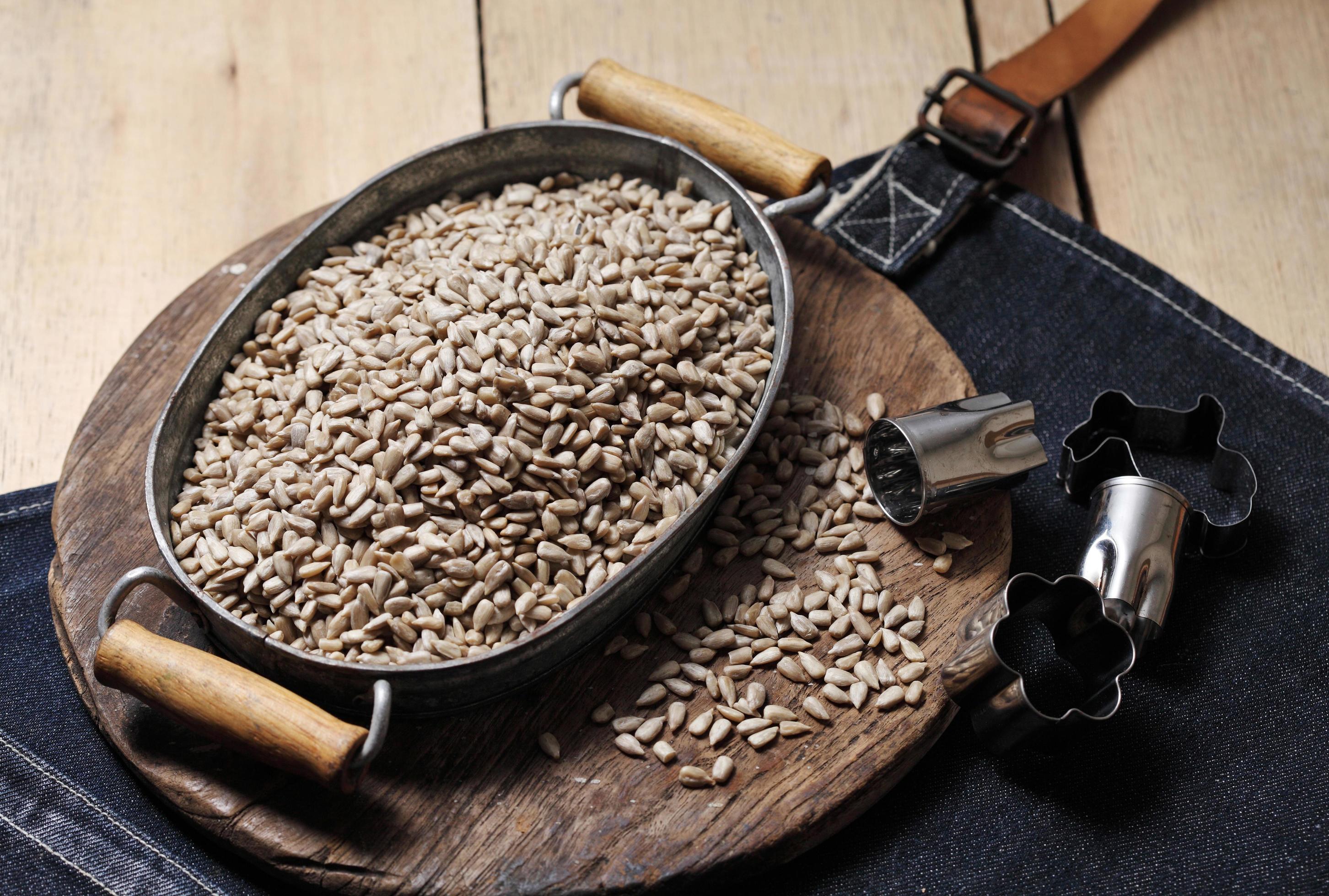 Sunflower seeds in iron tray on rustic background 3406076 Stock Photo