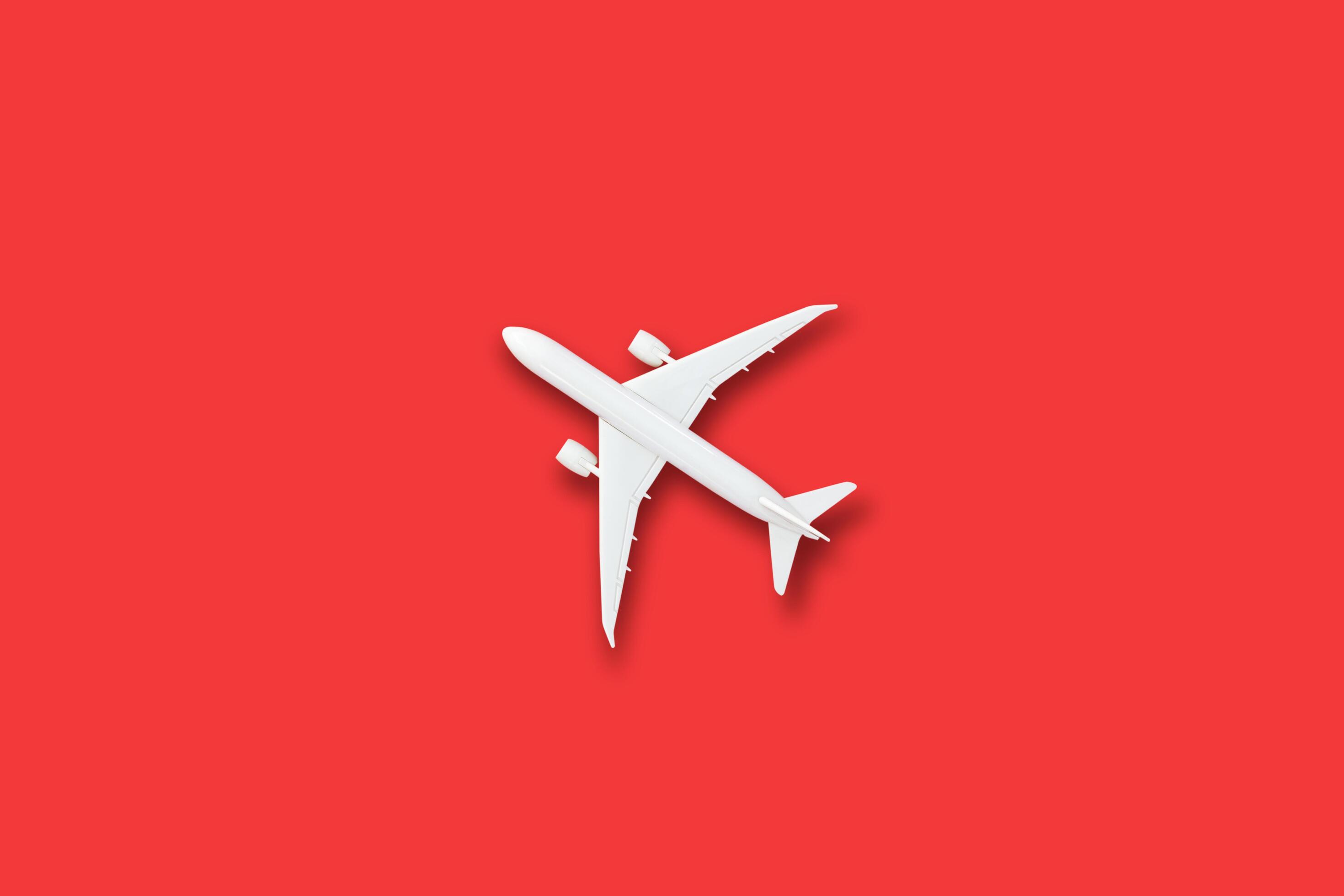 Model white plane, airplane on red color background 3406260 Stock Photo at  Vecteezy