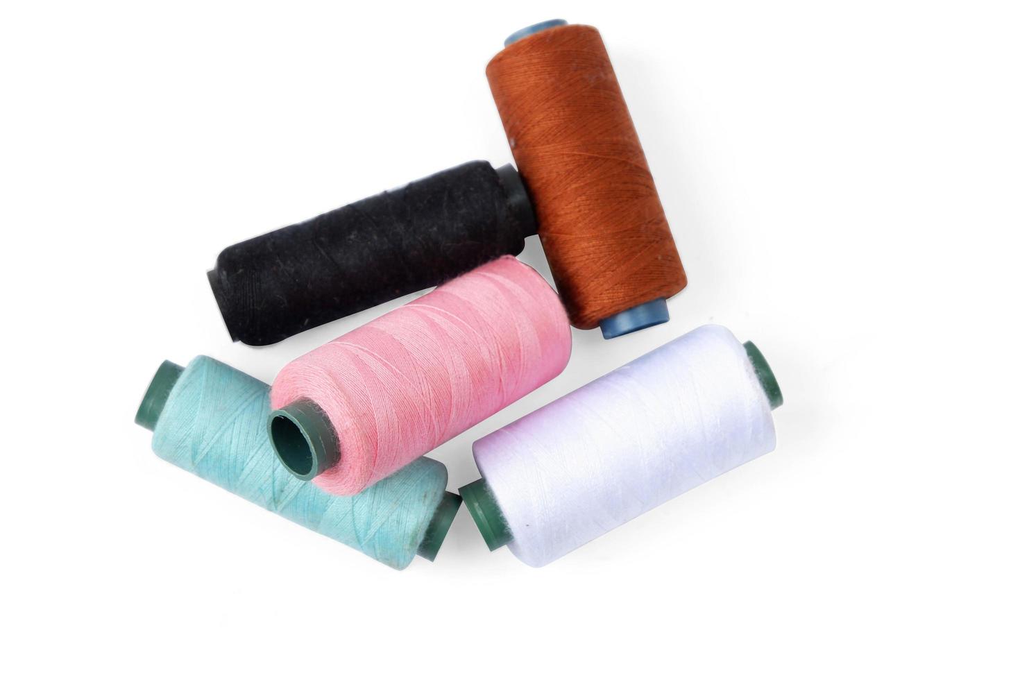 Color sewing thread isolated on a white background photo