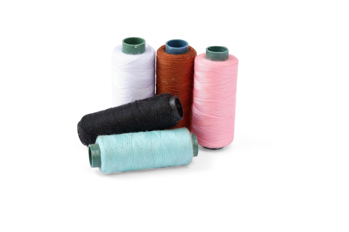 Color sewing thread isolated on a white background photo