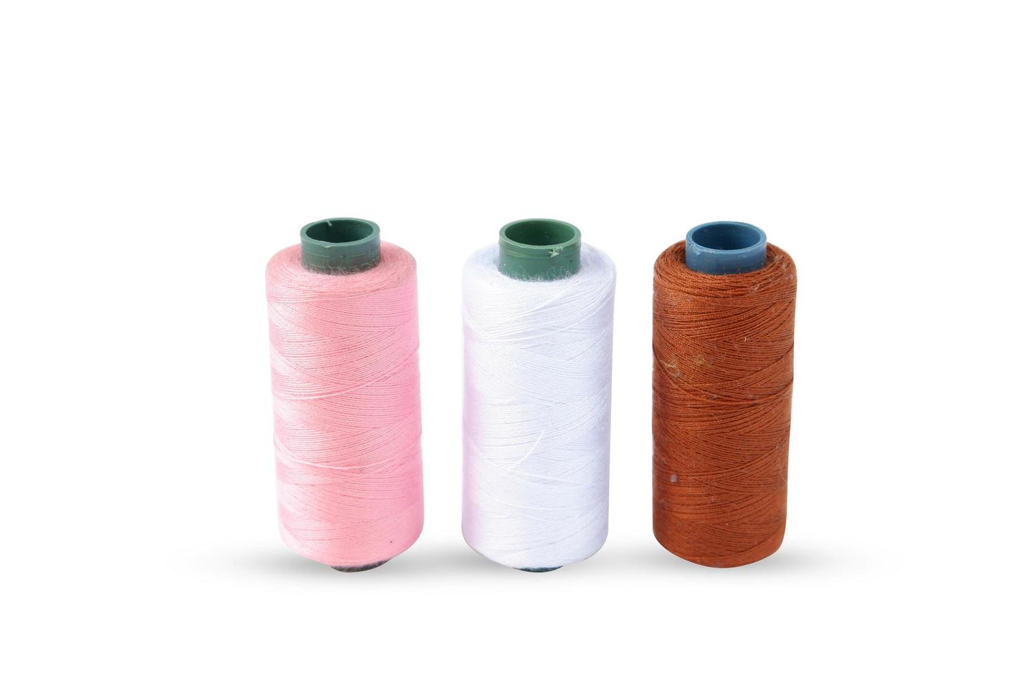 Color sewing thread isolated on a white background photo