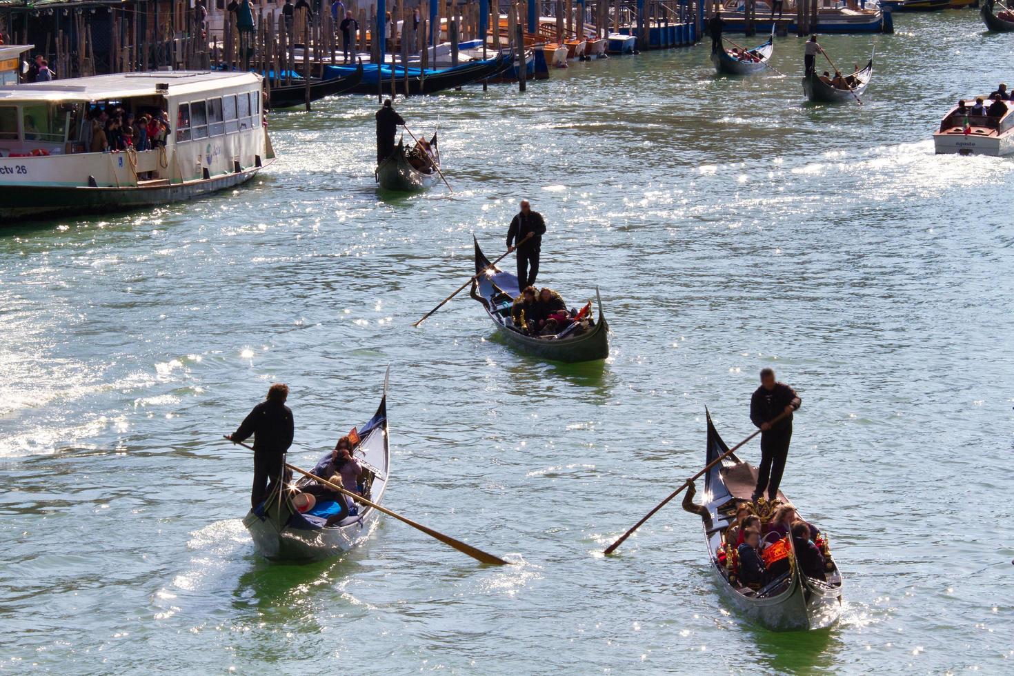 Traditional Venice Cityscape with narrow canal, gondola photo