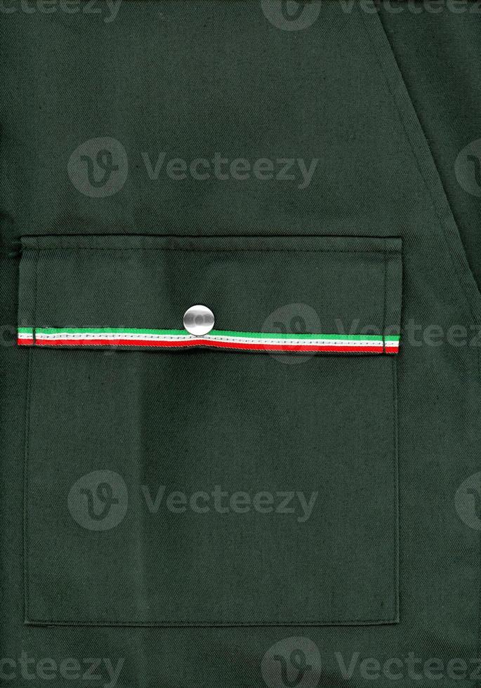 Green military jacket with flag of Italy photo