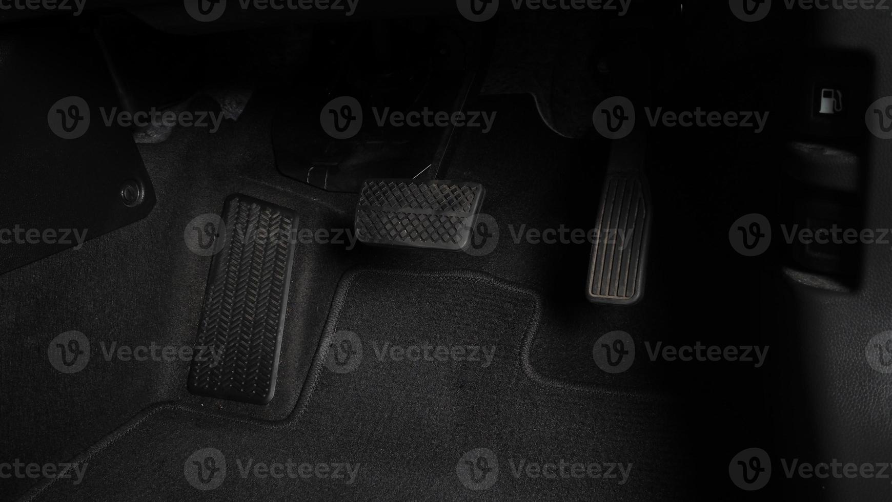 Accelerator and brake pedal inside the car photo